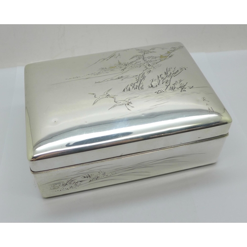 877 - A Chinese silver box with lake scene to the lid, total weight 367g, width 14cm, wood lining a/f