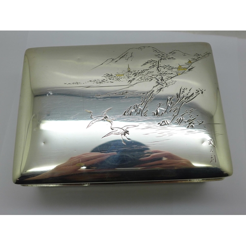 877 - A Chinese silver box with lake scene to the lid, total weight 367g, width 14cm, wood lining a/f