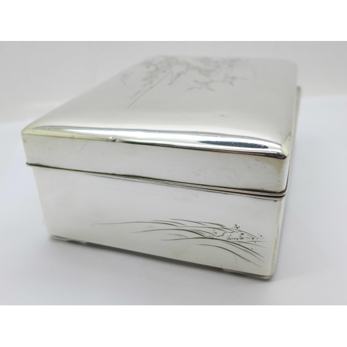 877 - A Chinese silver box with lake scene to the lid, total weight 367g, width 14cm, wood lining a/f