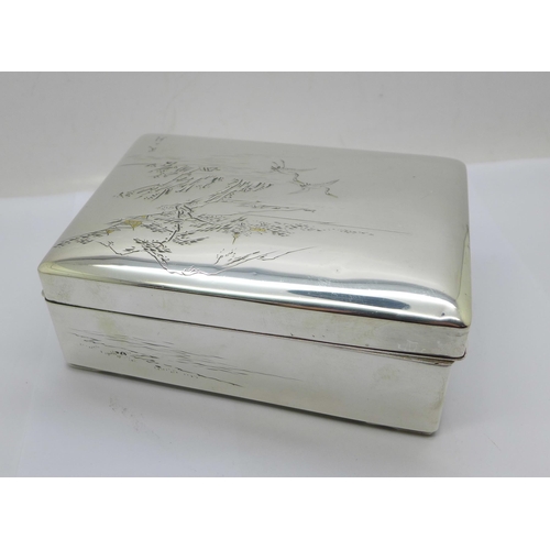 877 - A Chinese silver box with lake scene to the lid, total weight 367g, width 14cm, wood lining a/f