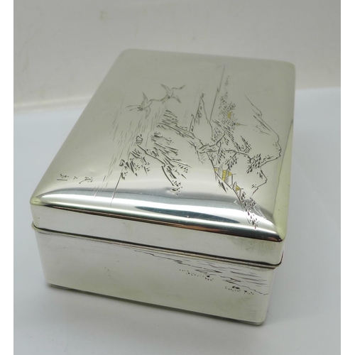 877 - A Chinese silver box with lake scene to the lid, total weight 367g, width 14cm, wood lining a/f