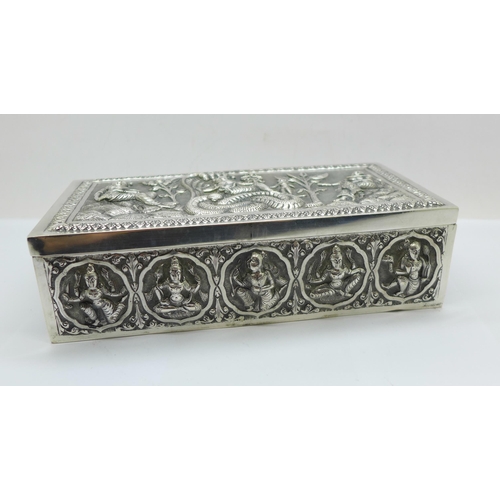 878 - An Eastern white metal cigarette box, total weight 395g, width 18cm, a/f, dented