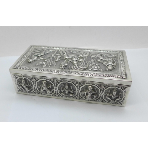 878 - An Eastern white metal cigarette box, total weight 395g, width 18cm, a/f, dented