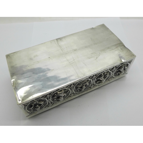 878 - An Eastern white metal cigarette box, total weight 395g, width 18cm, a/f, dented