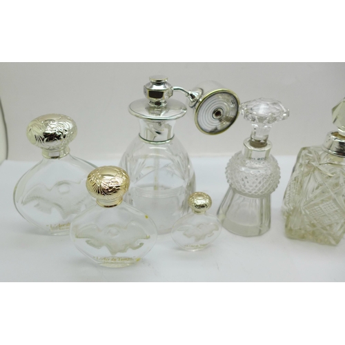 884 - Three silver mounted glass scent bottles including one thistle shaped and hallmarked Birmingham 1900... 