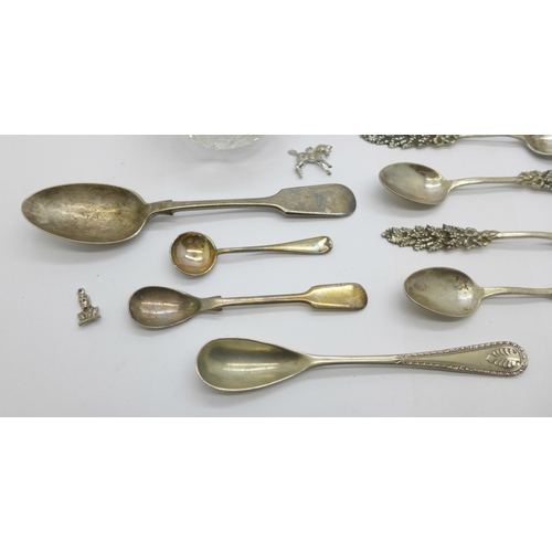 902 - A silver rimmed glass salt, a set of five white metal spoons, four plated spoons, etc.