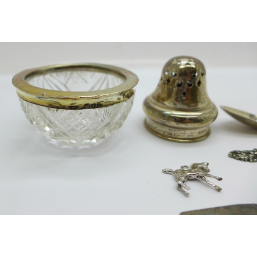 902 - A silver rimmed glass salt, a set of five white metal spoons, four plated spoons, etc.