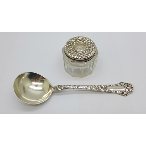 905 - A silver topped glass pot and a silver spoon with import mark, 26g of silver