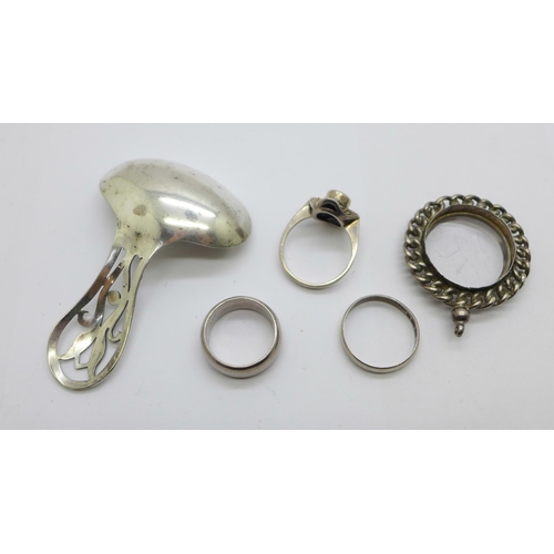 910 - Three silver rings including two hallmarked c1900, a caddy spoon and a pendant mount