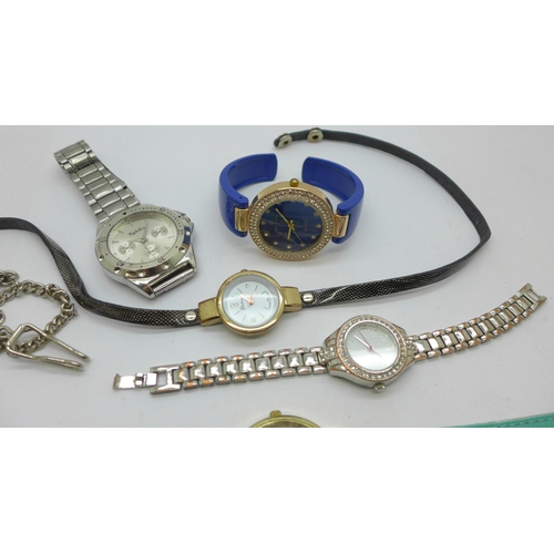 935 - Six fashion wristwatches and a pocket watch