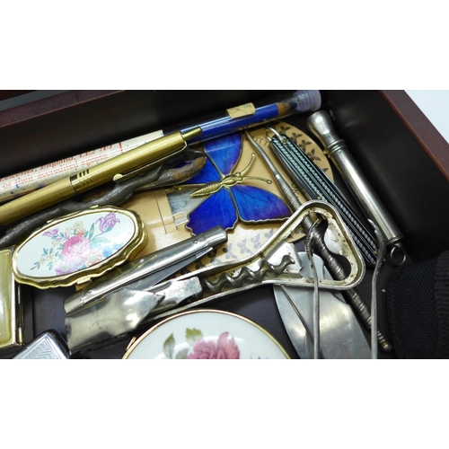 947 - A wooden box with contents, penknives, pens, an Acme City whistle, etc.