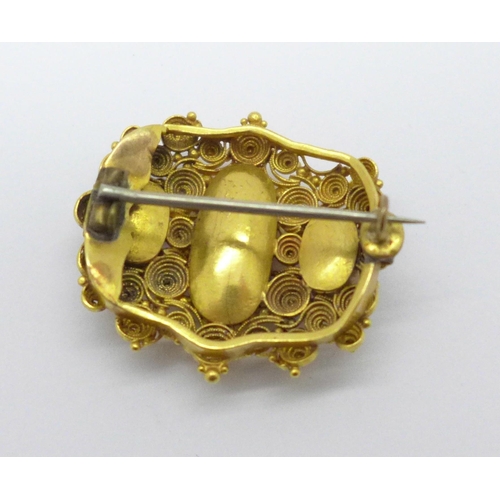 966 - A Victorian yellow metal and three stone amethyst brooch, 10.4g, (tests as 18ct gold), a/f, centre s... 