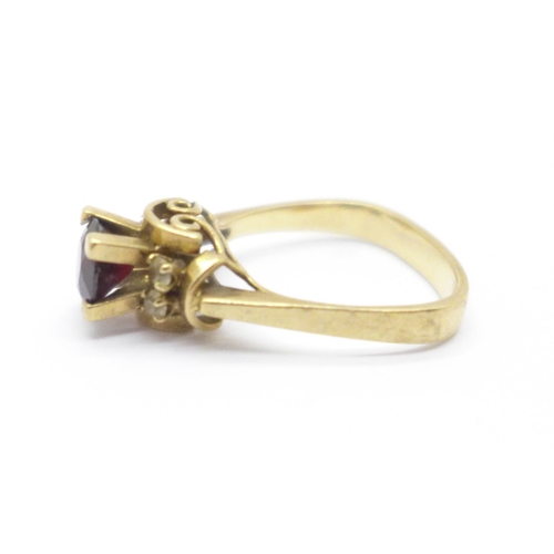 972 - A 9ct gold garnet solitaire ring, 3.4g, L