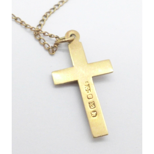 974 - A 9ct gold crucifix on a yellow metal chain, 2.2g, (tests as 9ct)