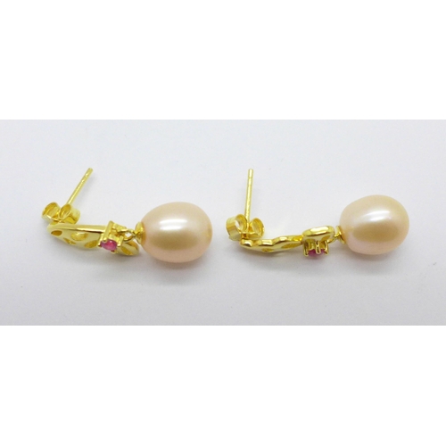 980 - A pair of silver gilt freshwater pearl and simulated ruby drop earrings