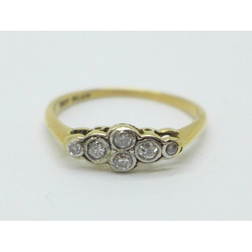 981 - A 1930's 18ct gold and platinum seven stone diamond ring, 2g, M