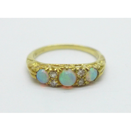 984 - An 18ct gold, opal and diamond ring, 3.3g, K