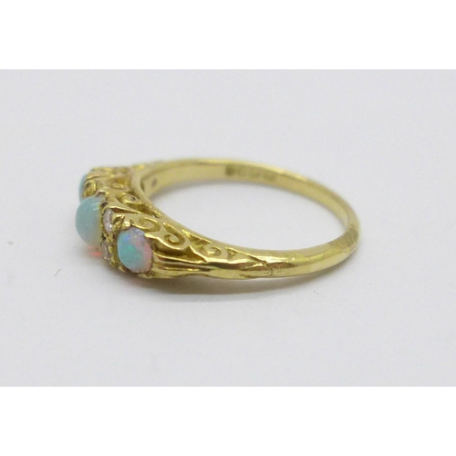 984 - An 18ct gold, opal and diamond ring, 3.3g, K