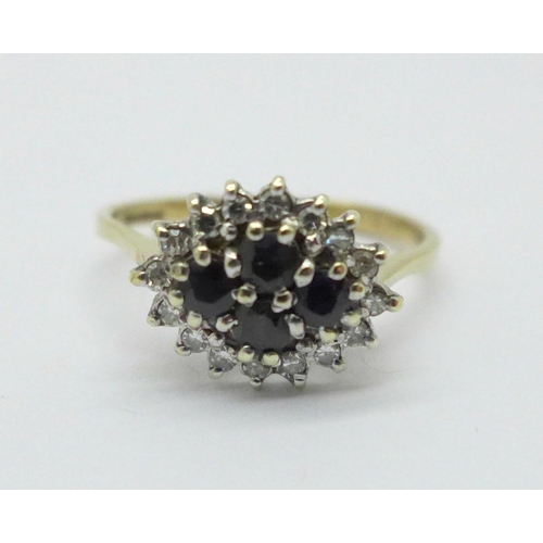 988 - A 9ct gold, sapphire and diamond cluster ring, 2.3g, P