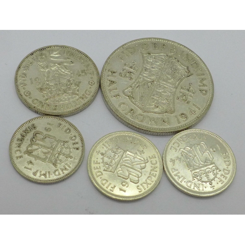 994 - A 1941 half crown, 1945 shilling and three sixpences, 1941 and two 1944