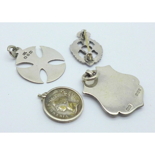 997 - Two silver fobs, a Victorian medal miniature and a sterling silver and enamel badge