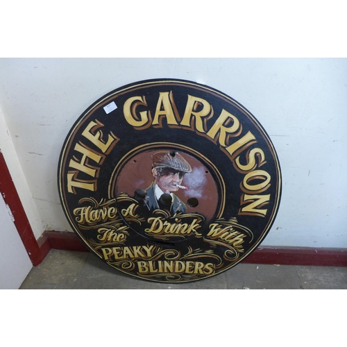 368 - A painted wooden pub sign, The Garrison