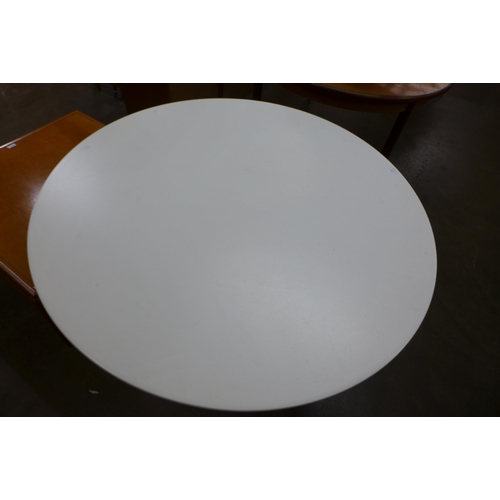 106 - An Eero Saarinen style chrome based circular dining table