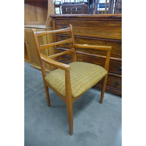 116 - A set of six teak dining chairs