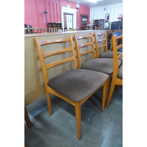 116 - A set of six teak dining chairs