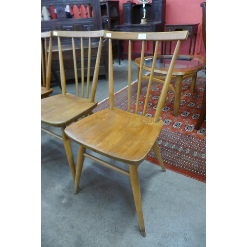 123 - A set of four Ercol Blonde elm and beech 391 model chairs