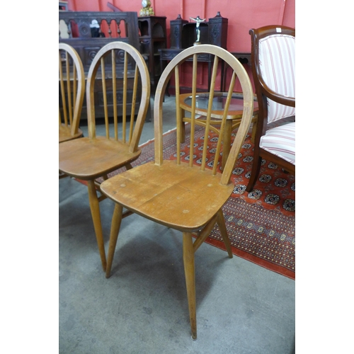 125 - A set of four Ercol Blonde elm and beech Windsor chairs