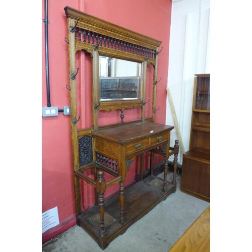 13 - A large Victorian Aesthetic Movement carved oak hallstand, manner of Bruce Talbert