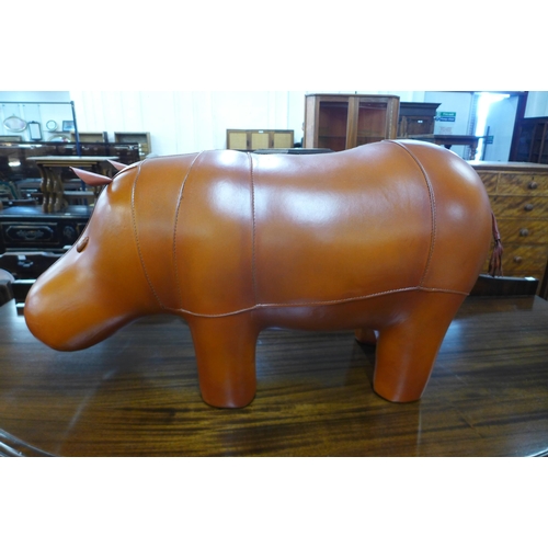 142 - A brown leather hippopotamus footstool