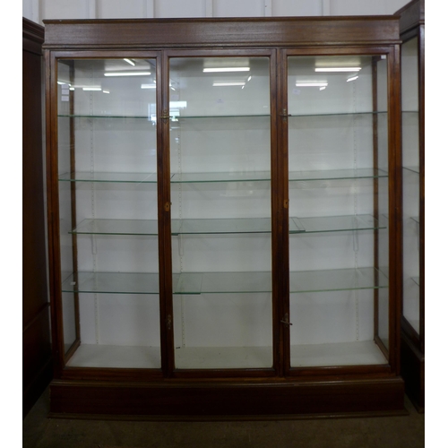 144 - A large mahogany three door shop display cabinet, made by F. Maund & E. Berg Ltd., Showcases & Shopf... 