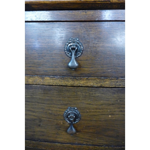 145 - An early 20th Century oak and stained glass bureau bookcase