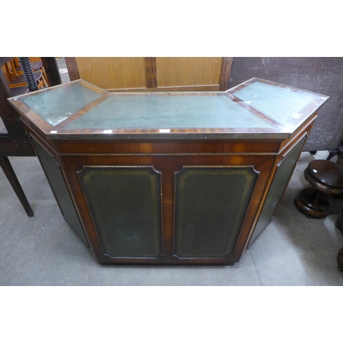 147 - A mahogany and green leather panelled bar