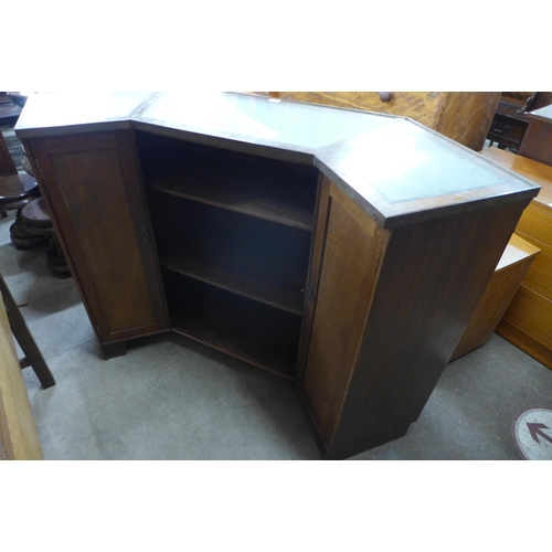 147 - A mahogany and green leather panelled bar