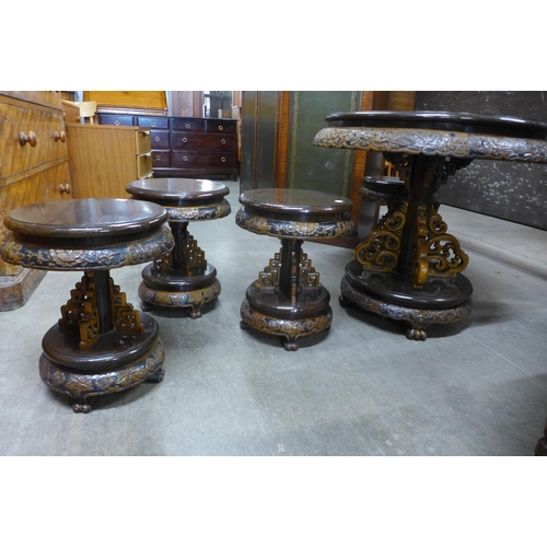 148 - An eastern carved hardwood circular table and four stools