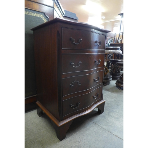 157 - A small mahogany serpentine chest of drawers