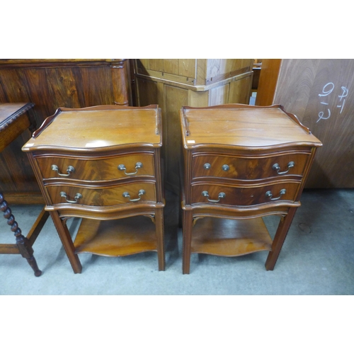 161 - A pair of mahogany serpentine night stands