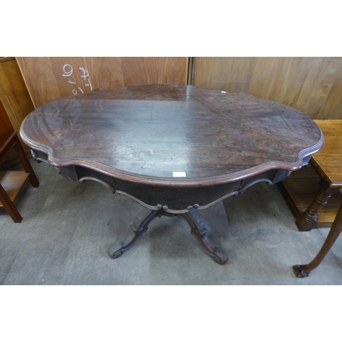 165 - A 19th Century French rosewood two drawer serpentine centre table