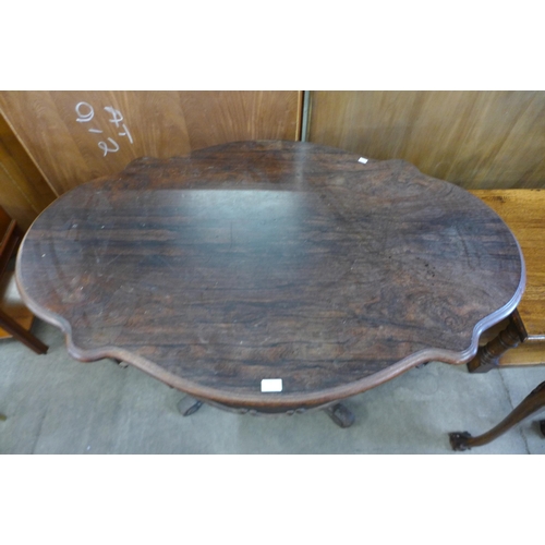 165 - A 19th Century French rosewood two drawer serpentine centre table