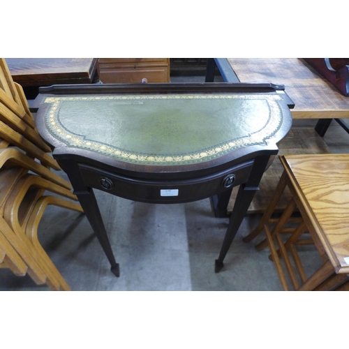 179 - A mahogany and green leather topped two drawer side table