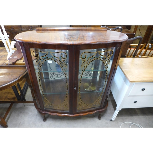 182 - A walnut display cabinet