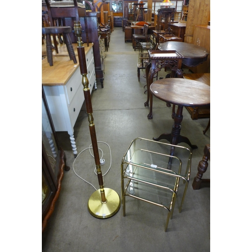 183 - A gilt metal and glass topped nest of tables and a standard lamp