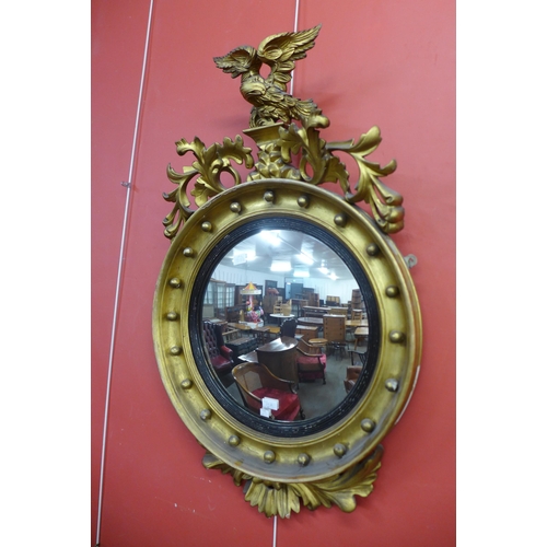 19a - A Regency gilt framed circular convex mirror