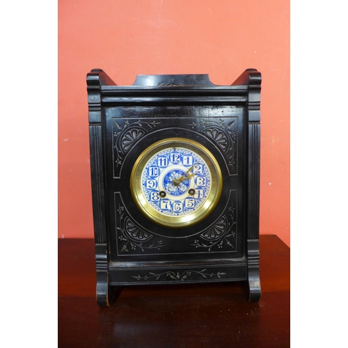 21 - A Victorian Aesthetic Movement ebonised bracket clock