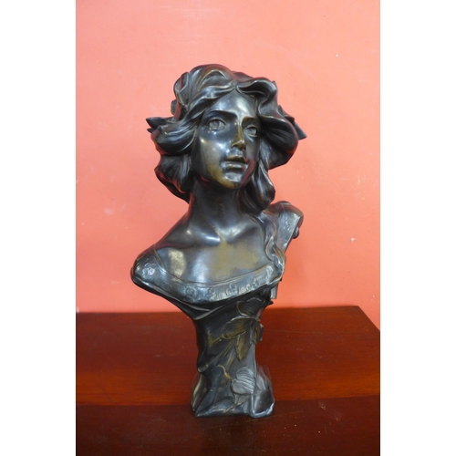 22 - An Art Nouveau style bust bronze effect bust of a lady