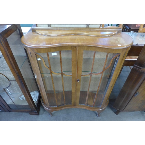 225 - An oak display cabinet and a walnut display cabinet