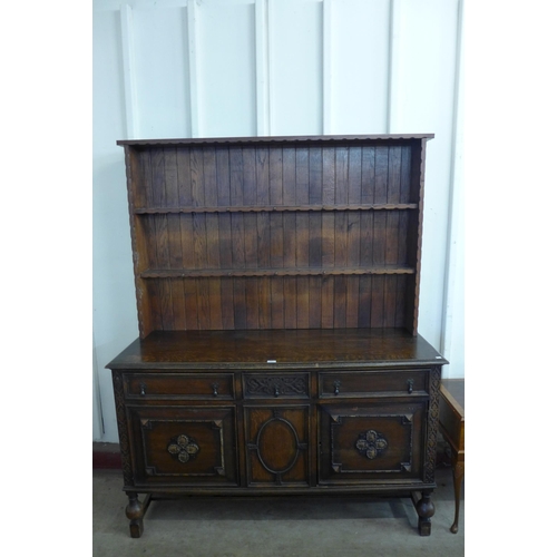 259 - A carved oak dresser a/f